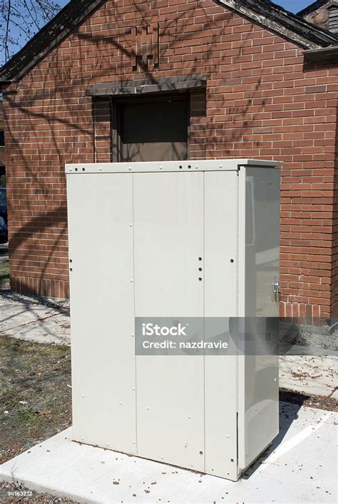 electrical communication box|telecommunications box in yard.